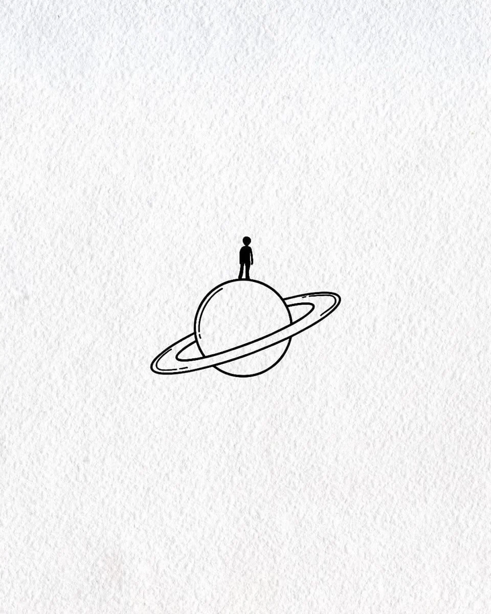 A small figure standing on a ringed planet