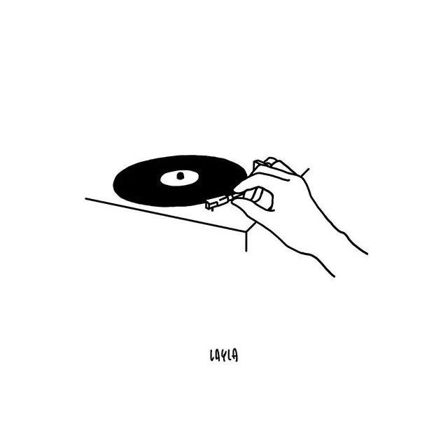 A hand cues a record on a turntable, signed LAYLA